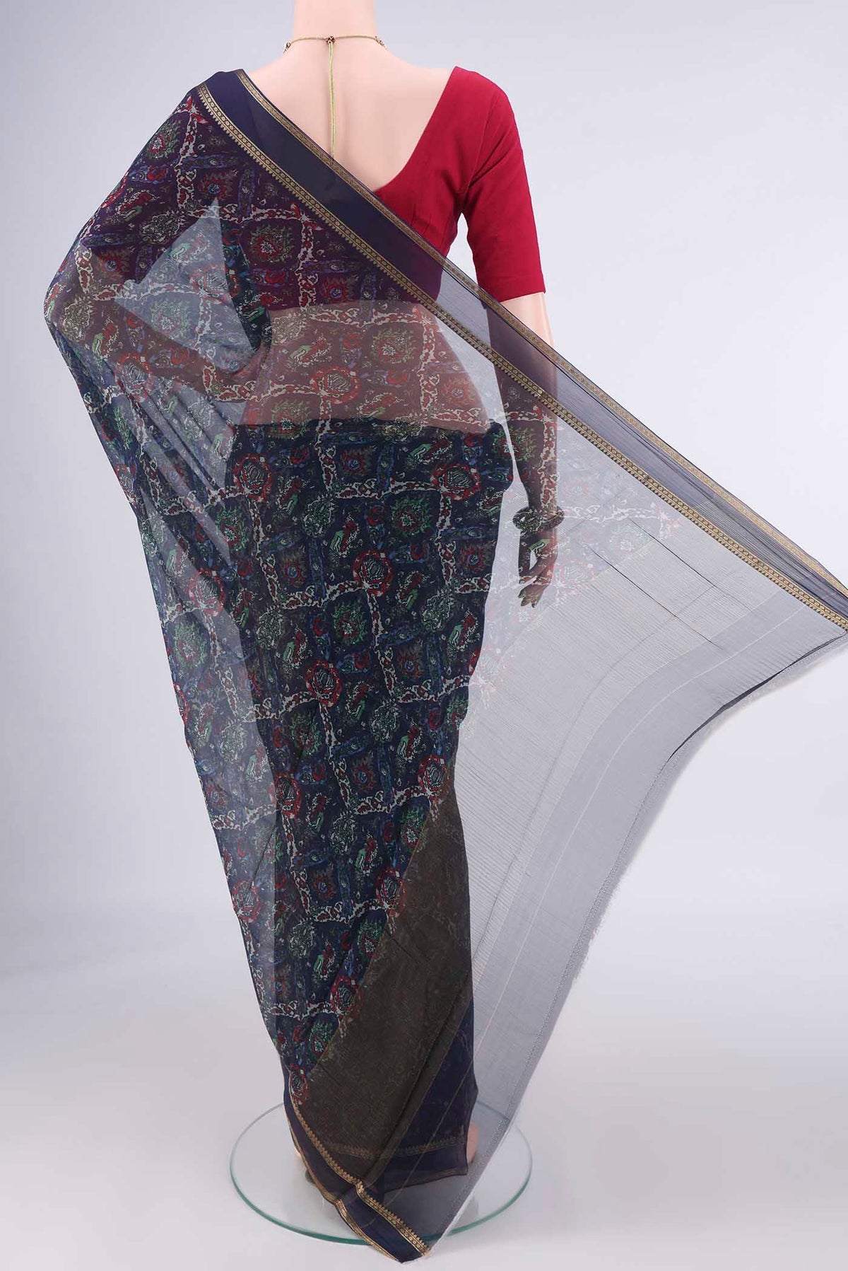 Flat view of Navy Blue Mysore Chiffon Saree with Printed design on the body and Zari Border. 