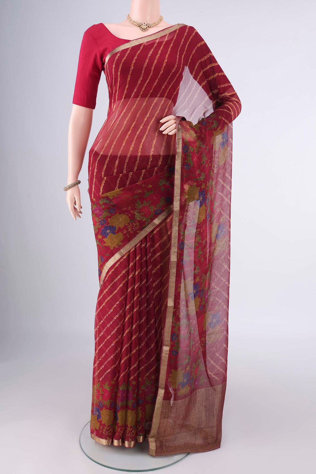 Red Mysore Chiffon Saree with Lehariya on the body and Zari Border.  displayed on a mannequin