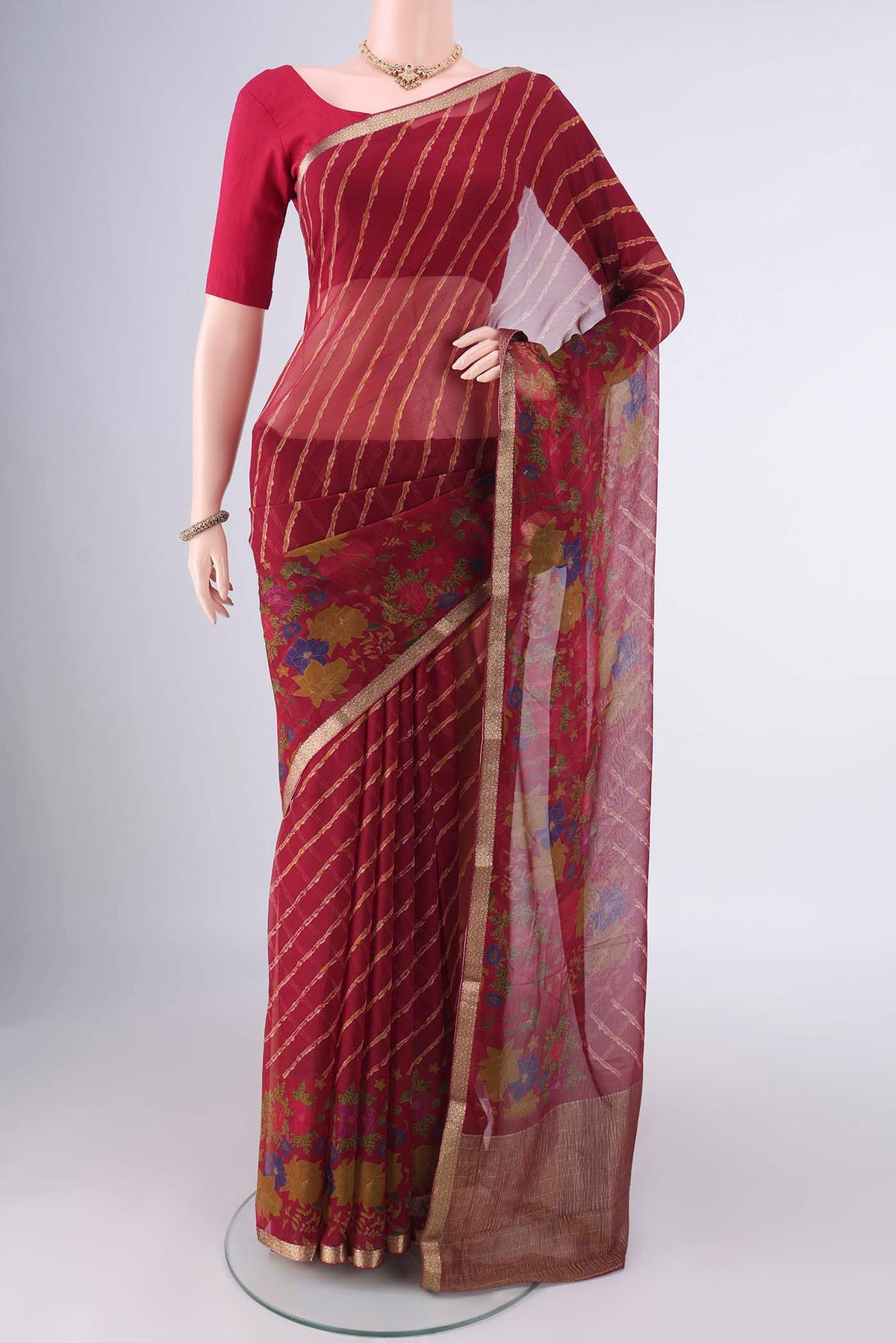 Red Mysore Chiffon Saree with Lehariya on the body and Zari Border.  displayed on a mannequin