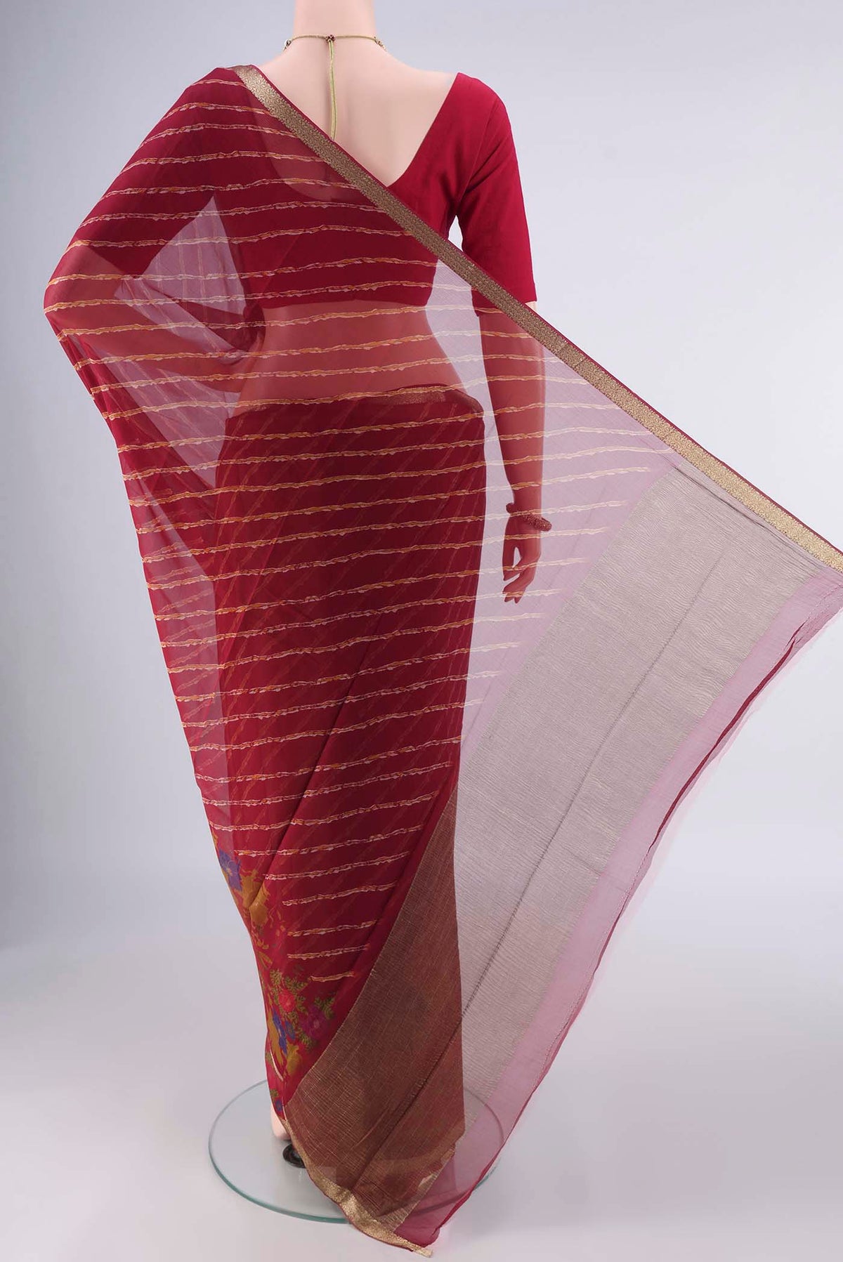 Flat view of Red Mysore Chiffon Saree with Lehariya on the body and Zari Border. 