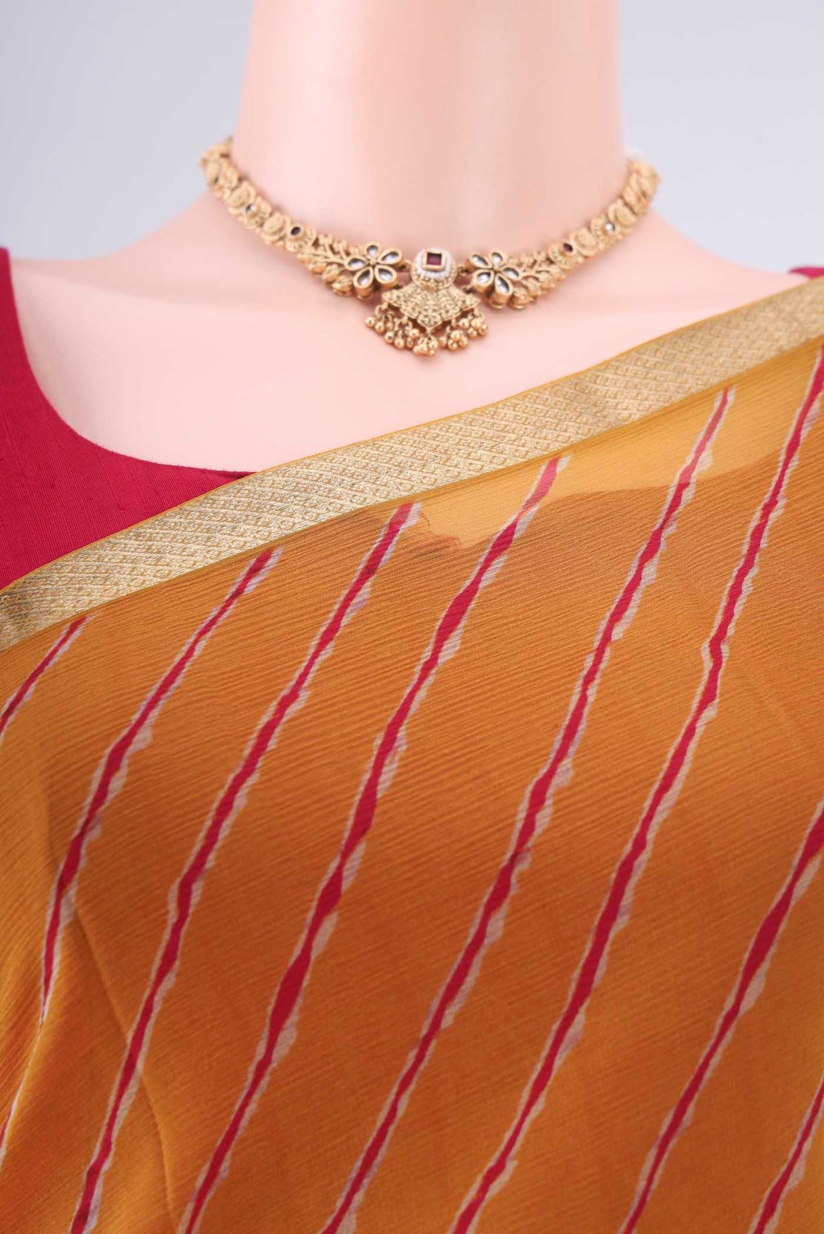 Border image of Mustard Mysore Chiffon Saree with Printed design on the body and Zari Border. 