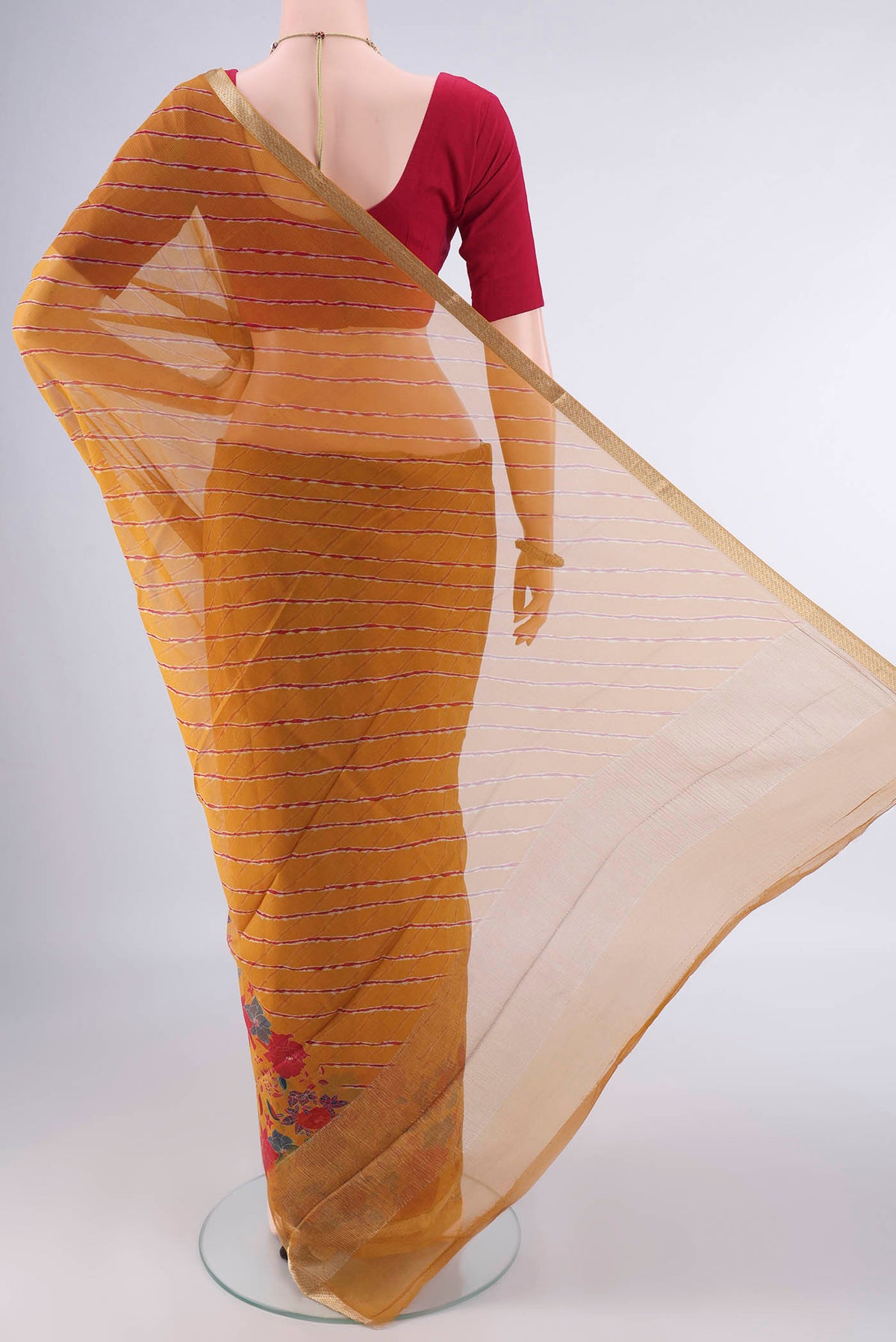 Flat view of Mustard Mysore Chiffon Saree with Printed design on the body and Zari Border. 