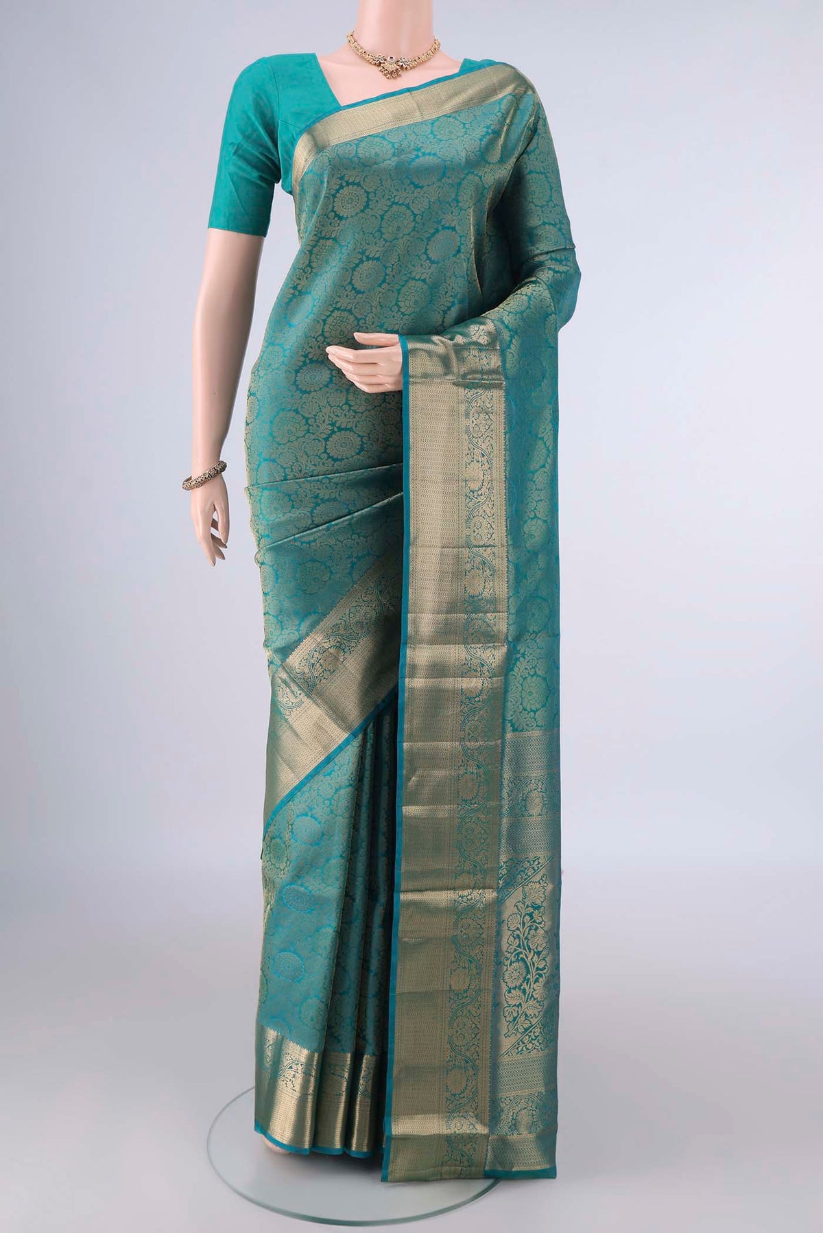 Pure Silk short color Dual Tone Soft Saree with Zari Brocade on the body and Zari Border.  displayed on a mannequin