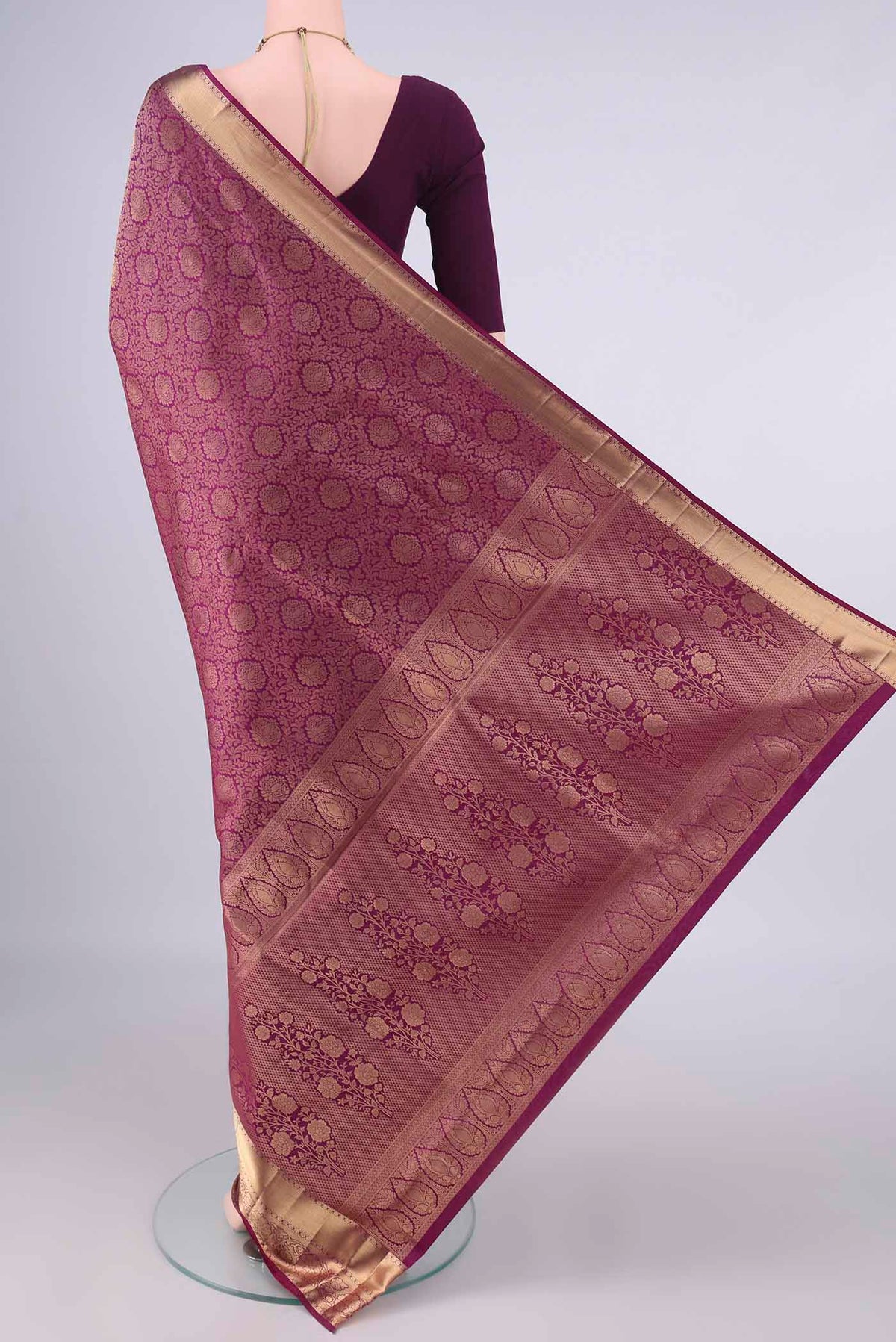 Flat view of Pure Silk Magenta Soft Saree with Zari Brocade on the body and Zari Border. 