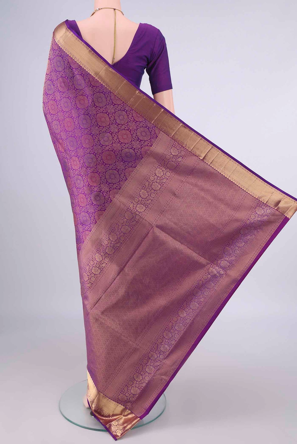Flat view of Pure Silk Purple Soft Saree with Zari Brocade on the body and Zari Border. 