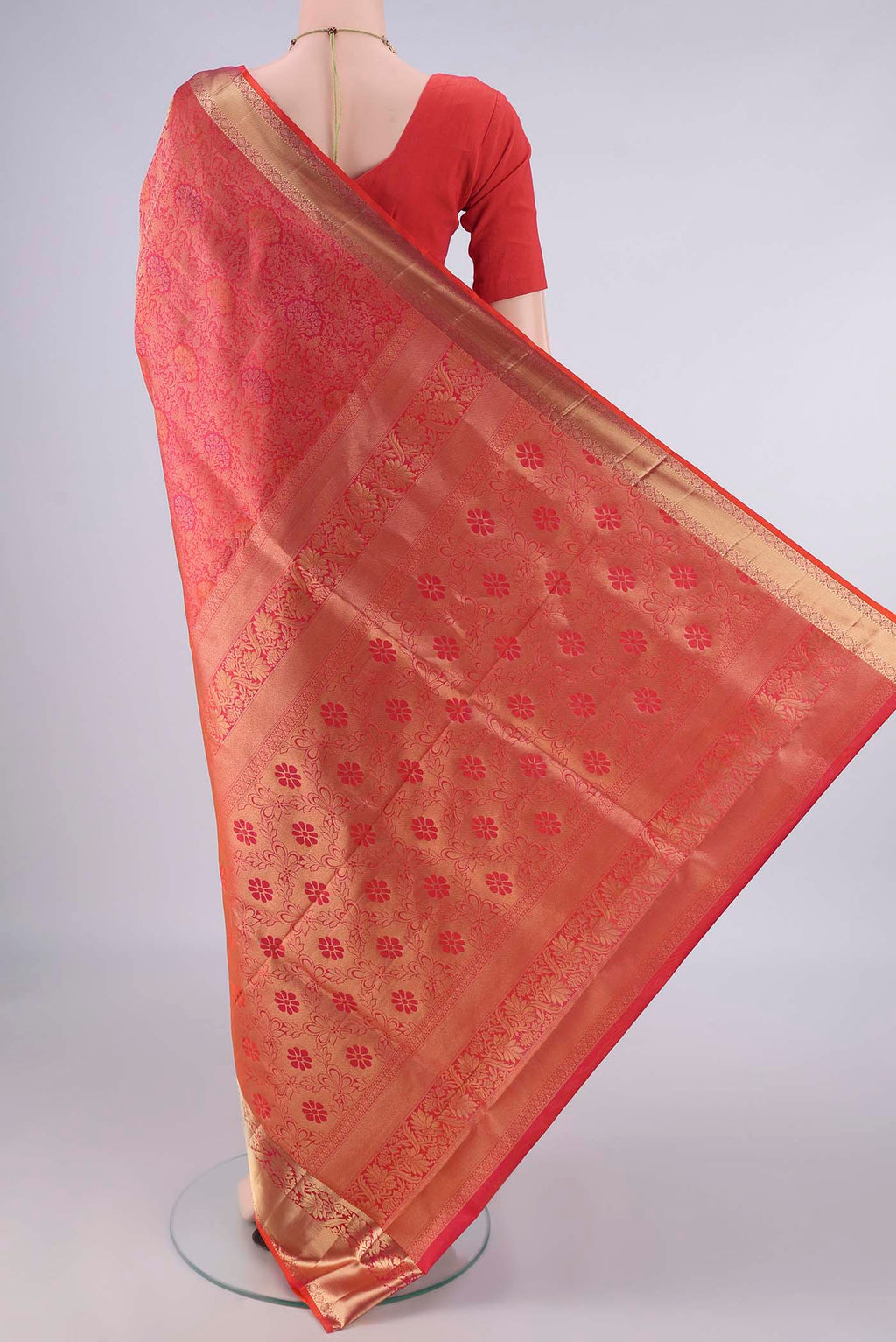 Flat view of Pure Silk Brick Orange Soft Saree with Zari Brocade on the body and Zari Border. 