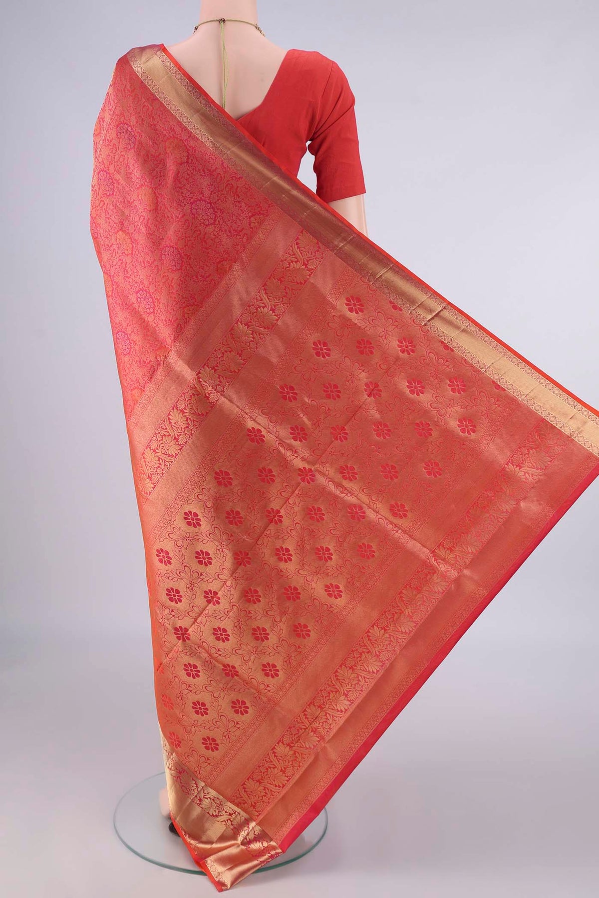 Flat view of Pure Silk Brick Orange Soft Saree with Zari Brocade on the body and Zari Border. 