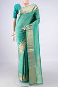 Pure Silk Sea Green Soft Saree with Zari Brocade on the body and Zari Border.  displayed on a mannequin