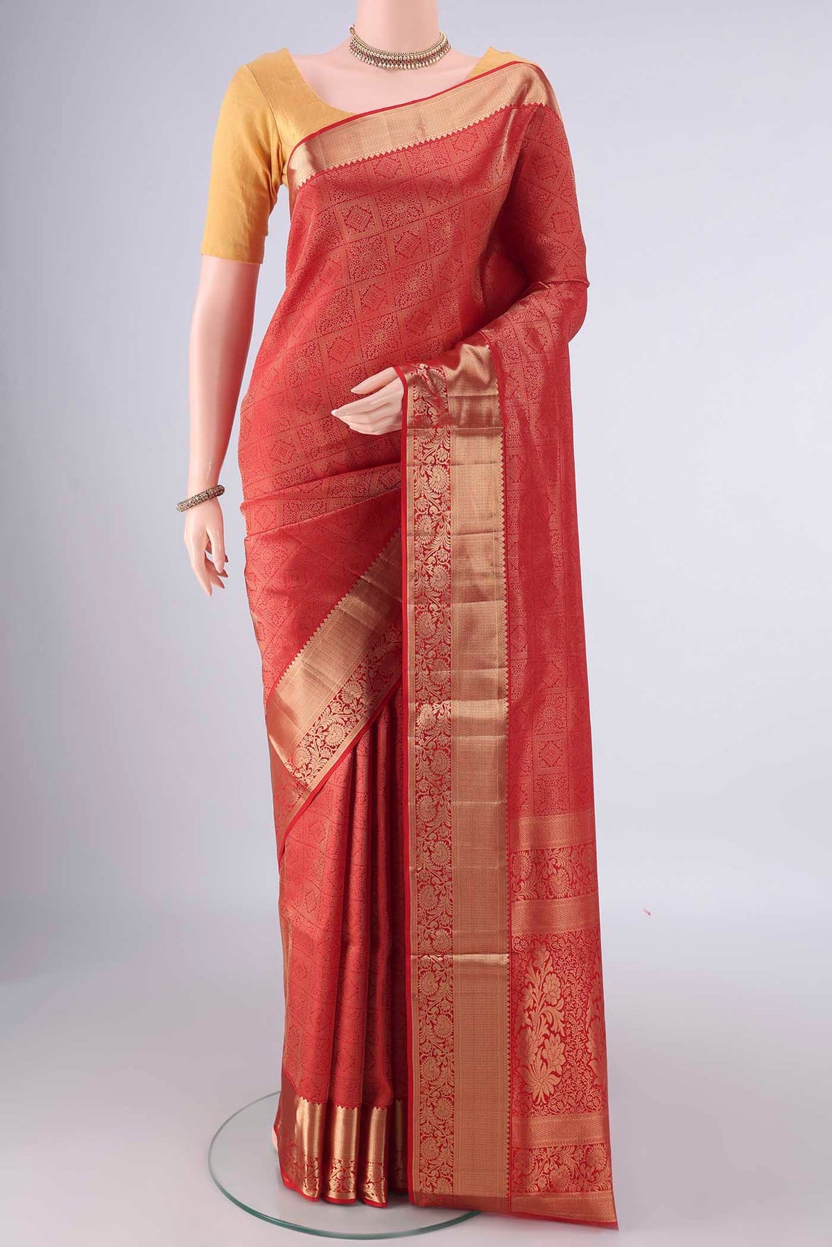 Pure Silk Red Soft Saree with Zari Brocade on the body and Zari Border.  displayed on a mannequin