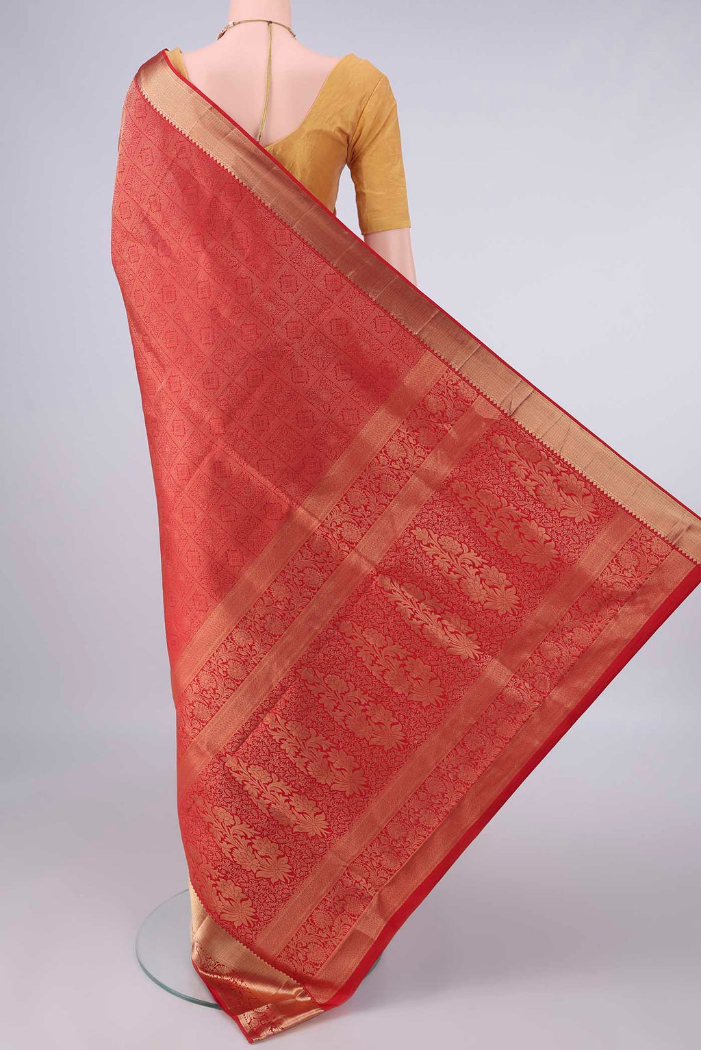 Flat view of Pure Silk Red Soft Saree with Zari Brocade on the body and Zari Border. 