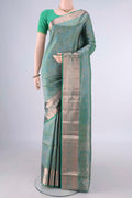 Pure Silk Light Green Dual Tone Soft Saree with Zari Brocade on the body and Zari Border.  displayed on a mannequin