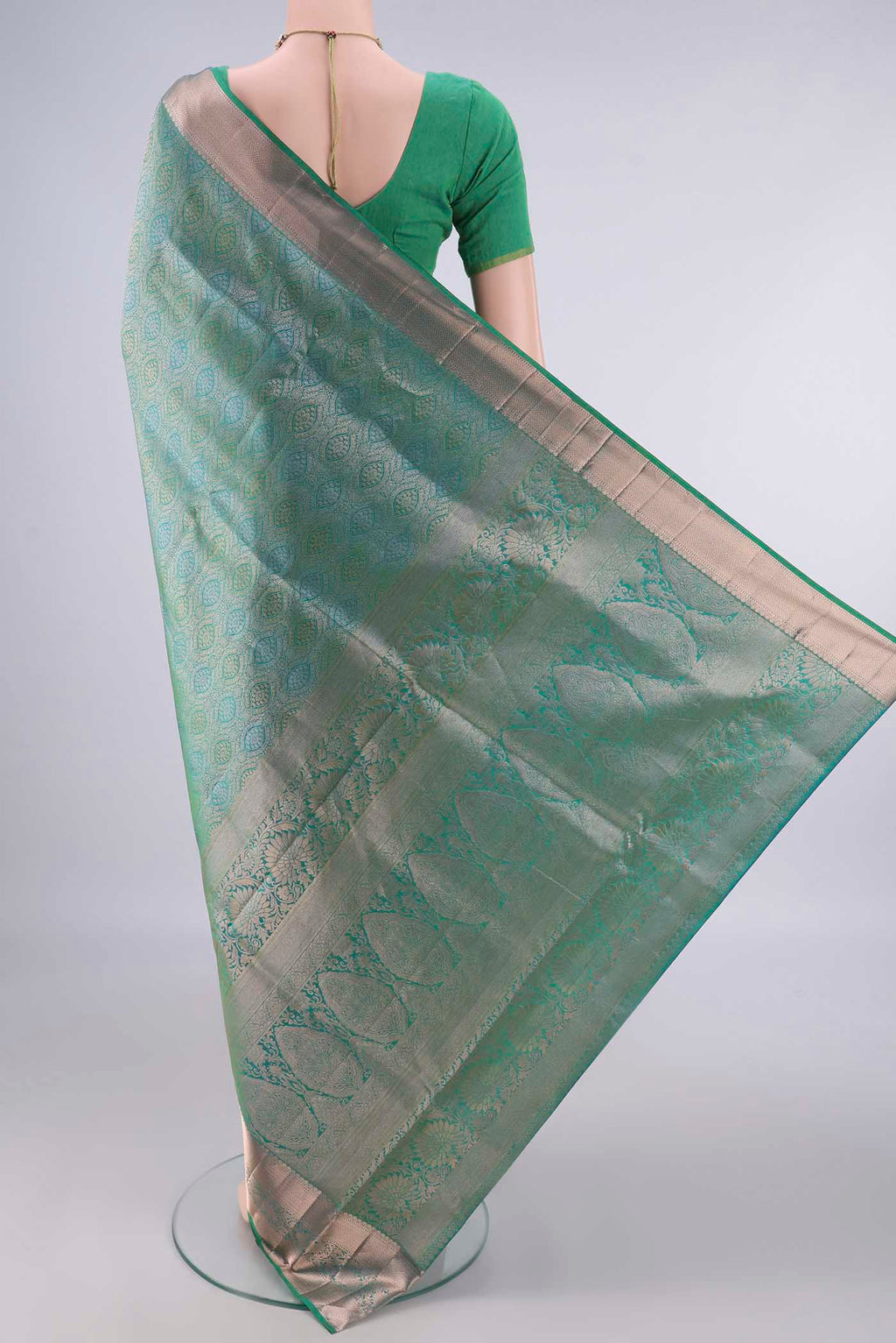 Flat view of Pure Silk Light Green Dual Tone Soft Saree with Zari Brocade on the body and Zari Border. 