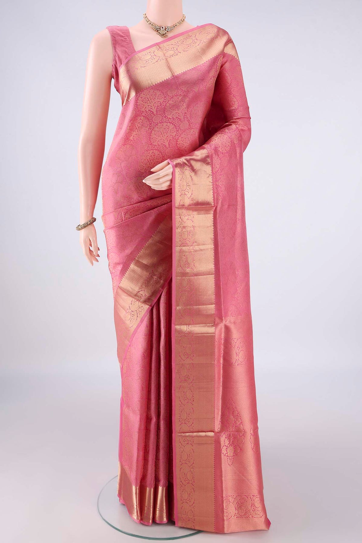 Pure Silk Pink Soft Saree with Zari Brocade on the body and Zari Border.  displayed on a mannequin