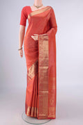 Pure Silk Brick Orange Soft Saree with Zari Brocade on the body and Zari Border.  displayed on a mannequin
