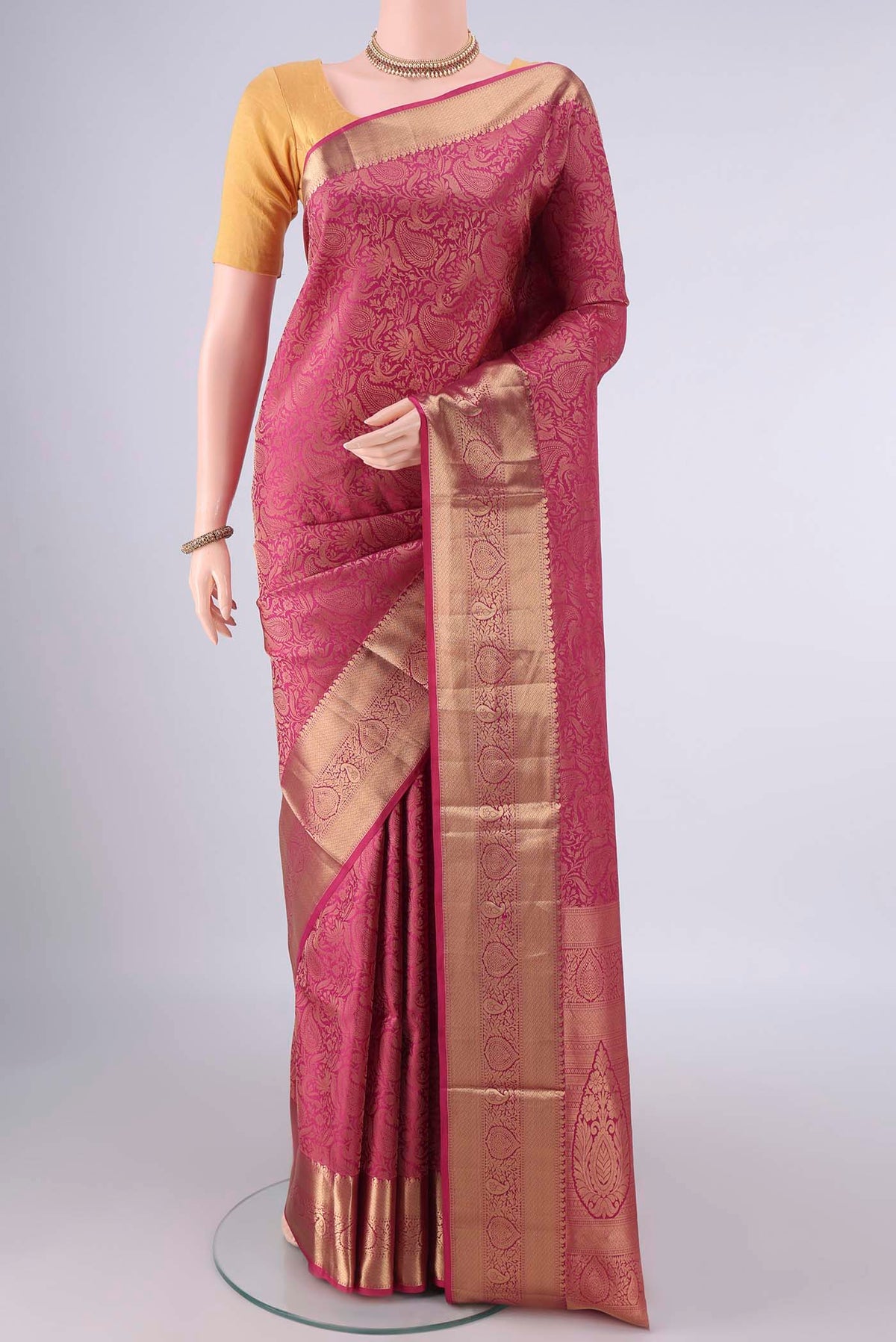 Pure Silk Pink Soft Saree with Zari Brocade on the body and Zari Border.  displayed on a mannequin