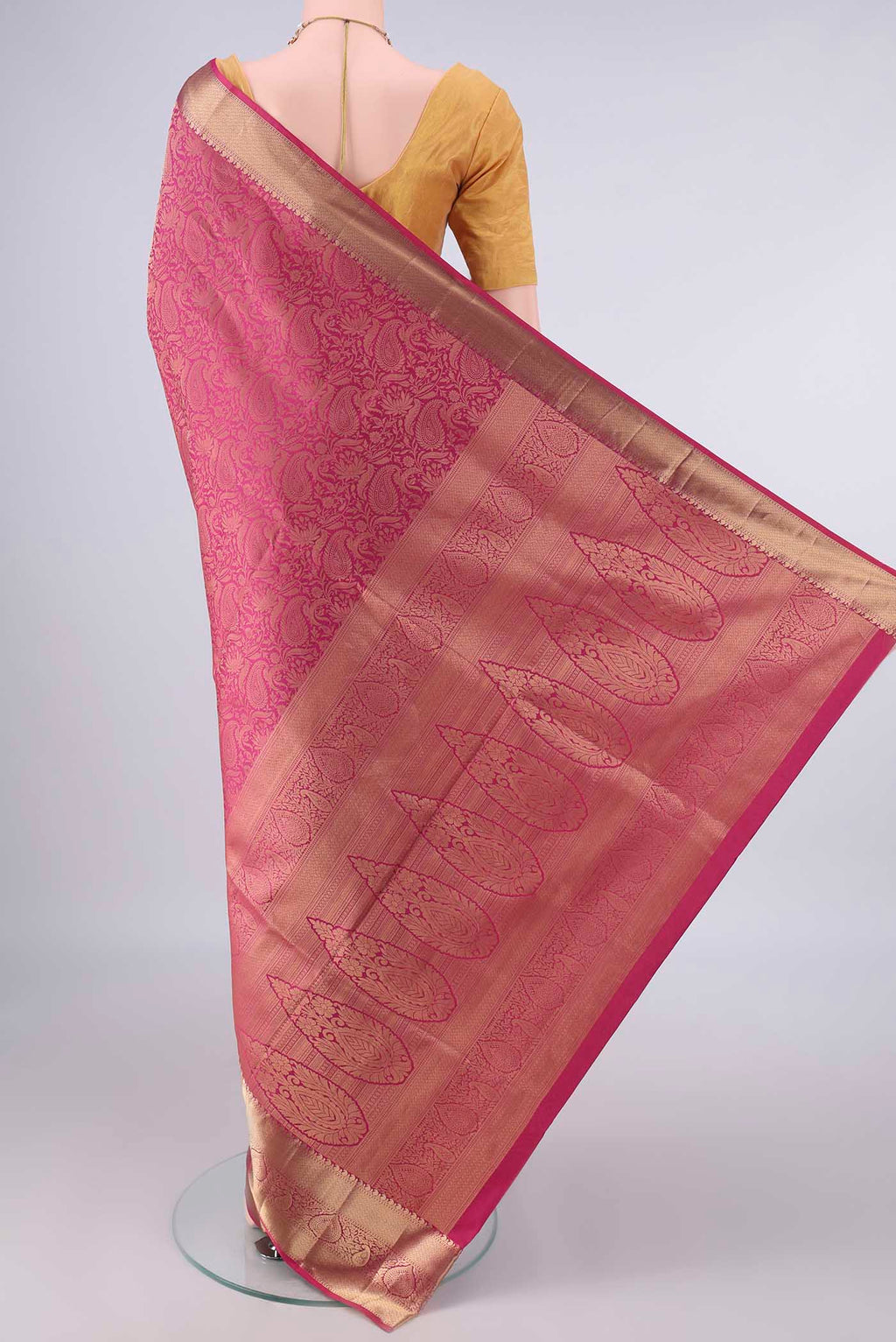Flat view of Pure Silk Pink Soft Saree with Zari Brocade on the body and Zari Border. 