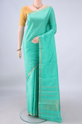 Pure Silk Sea Green Kanjivaram Saree with Plain Body and Zari Border.  displayed on a mannequin