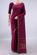 Pure Silk Maroon Kanjivaram Saree with Plain Body and Zari Border.  displayed on a mannequin