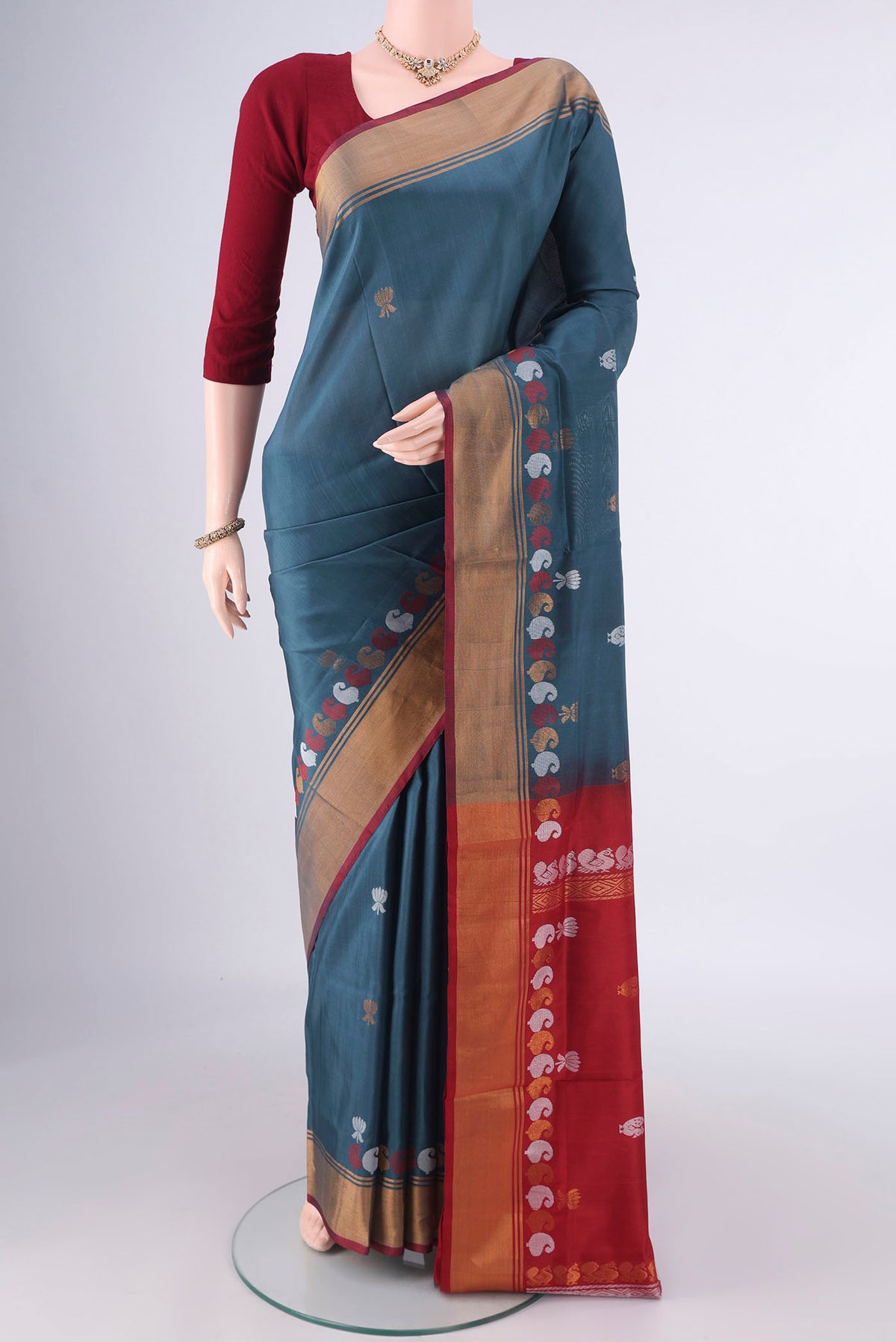 Pure Silk Davys Grey Uppada Saree with Zari Butta on the body and Zari Border.  displayed on a mannequin