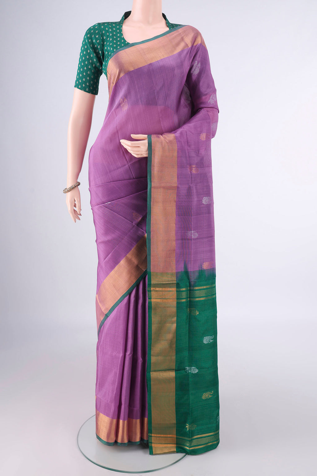 Pure Silk Mauve Uppada Saree with Zari Butta on the body and Zari Border.  displayed on a mannequin