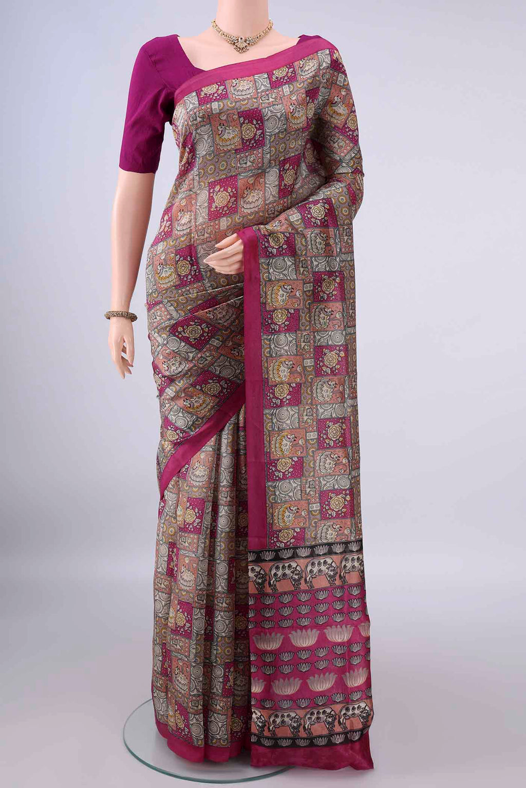 Pure Silk Grey Printed Saree with Printed design on the body and Printed Border.  displayed on a mannequin
