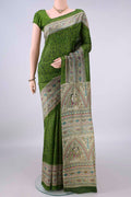 Pure Silk Green Printed Saree with Printed design on the body and Printed Border.  displayed on a mannequin