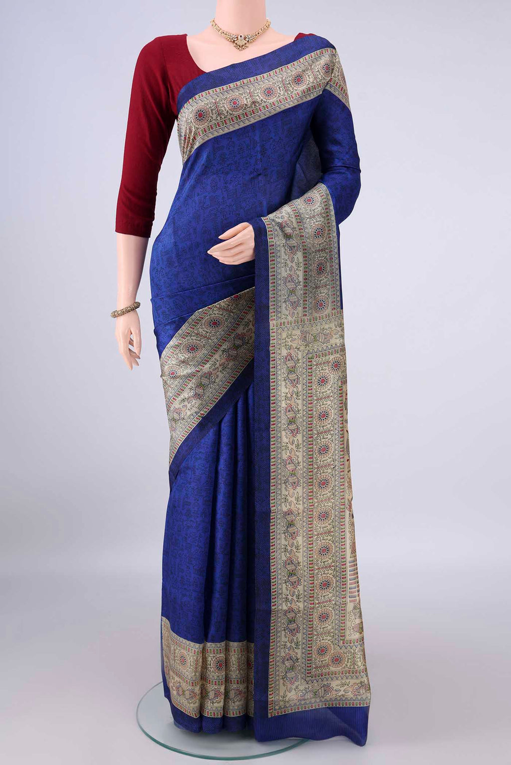 Pure Silk Royal Blue Printed Saree with Printed design on the body and Printed Border.  displayed on a mannequin