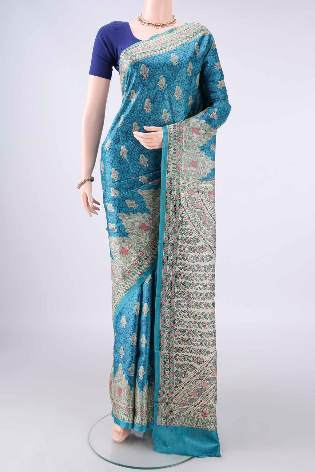 Blue Tussar Saree with Printed design on the body and Printed Border.  displayed on a mannequin