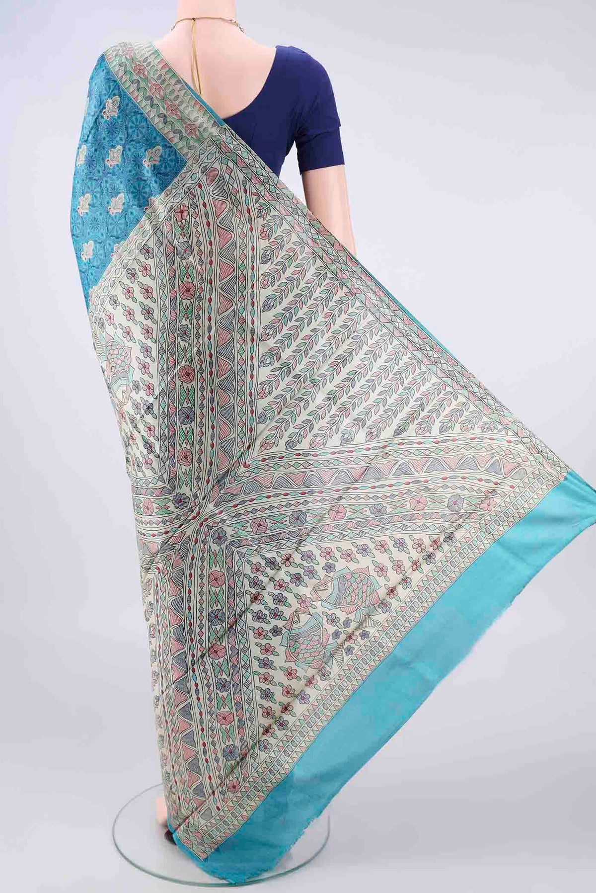 Flat view of Blue Tussar Saree with Printed design on the body and Printed Border. 