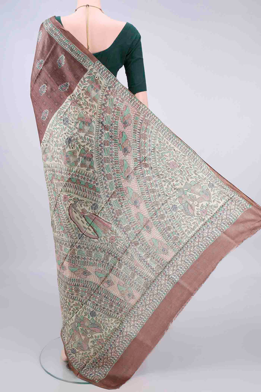 Flat view of Brown Tussar Saree with Printed design on the body and Printed Border. 