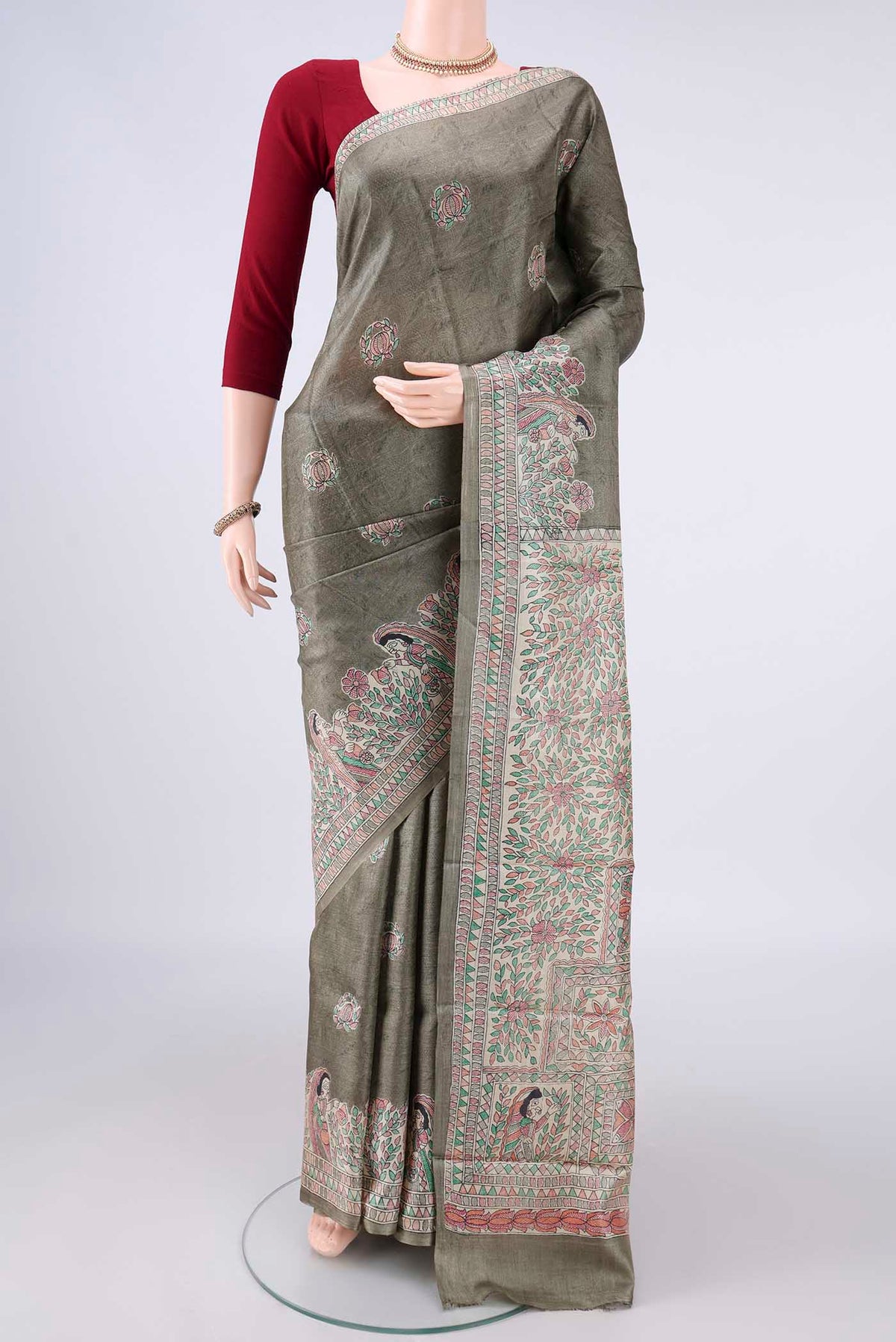 Sage Green Tussar Saree with Printed design on the body and Without Border.  displayed on a mannequin