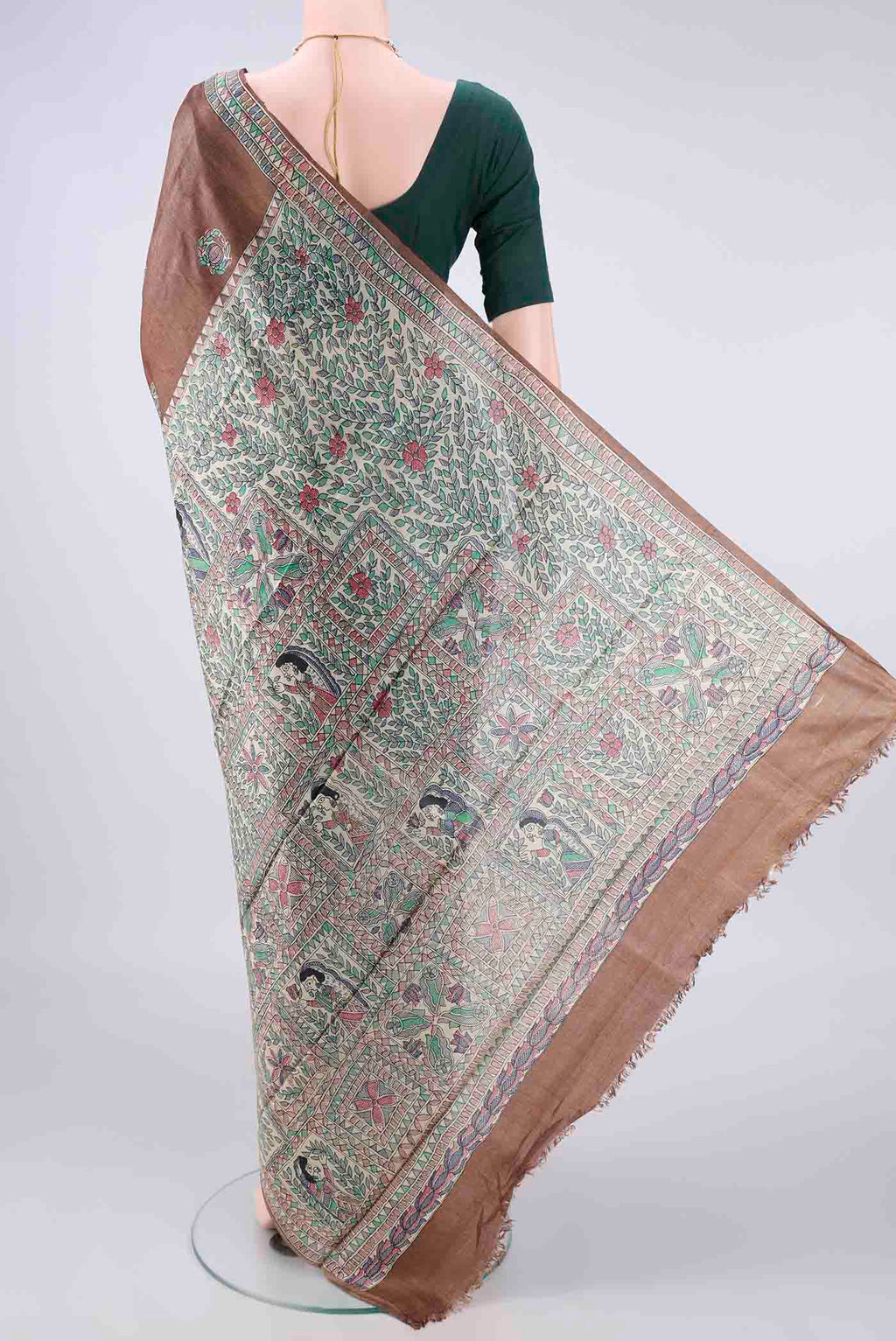 Flat view of Brown Tussar Saree with Printed design on the body and Printed Border. 