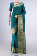 Pure Silk Teal Kanchipuram Saree with Zari Butta on the body and Zari Border.  displayed on a mannequin
