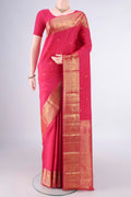 Pure Silk Rani Pink Kanchipuram Saree with Zari Butta on the body and Zari Border.  displayed on a mannequin