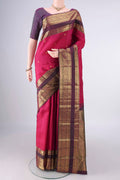Pure Silk Rani Pink Kanchipuram Saree with Zari Butta on the body and Zari Border.  displayed on a mannequin