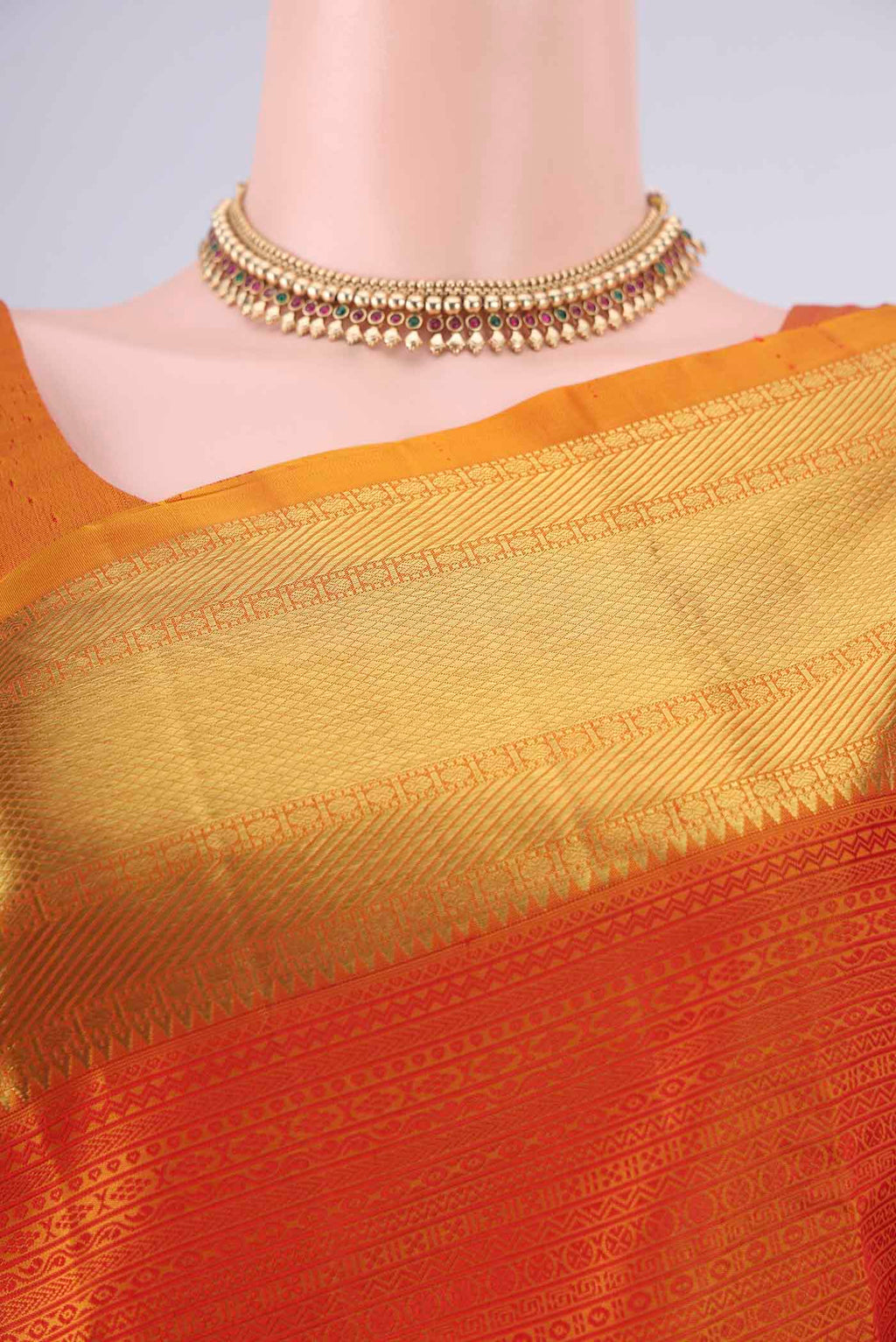 Border image of Pure Silk Orange Kanjivaram Saree with Jacquard design on the body and Zari Border. 