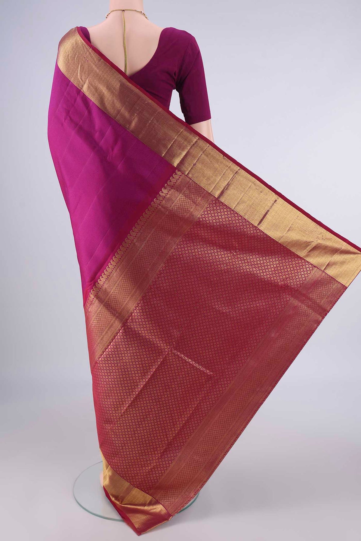 Flat view of Pure Silk Magenta Kanjivaram Saree with Jacquard design on the body and Zari Border. 