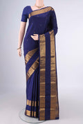 Pure Silk Dark Blue Kanchipuram Saree with Zari Butta on the body and Zari Border.  displayed on a mannequin