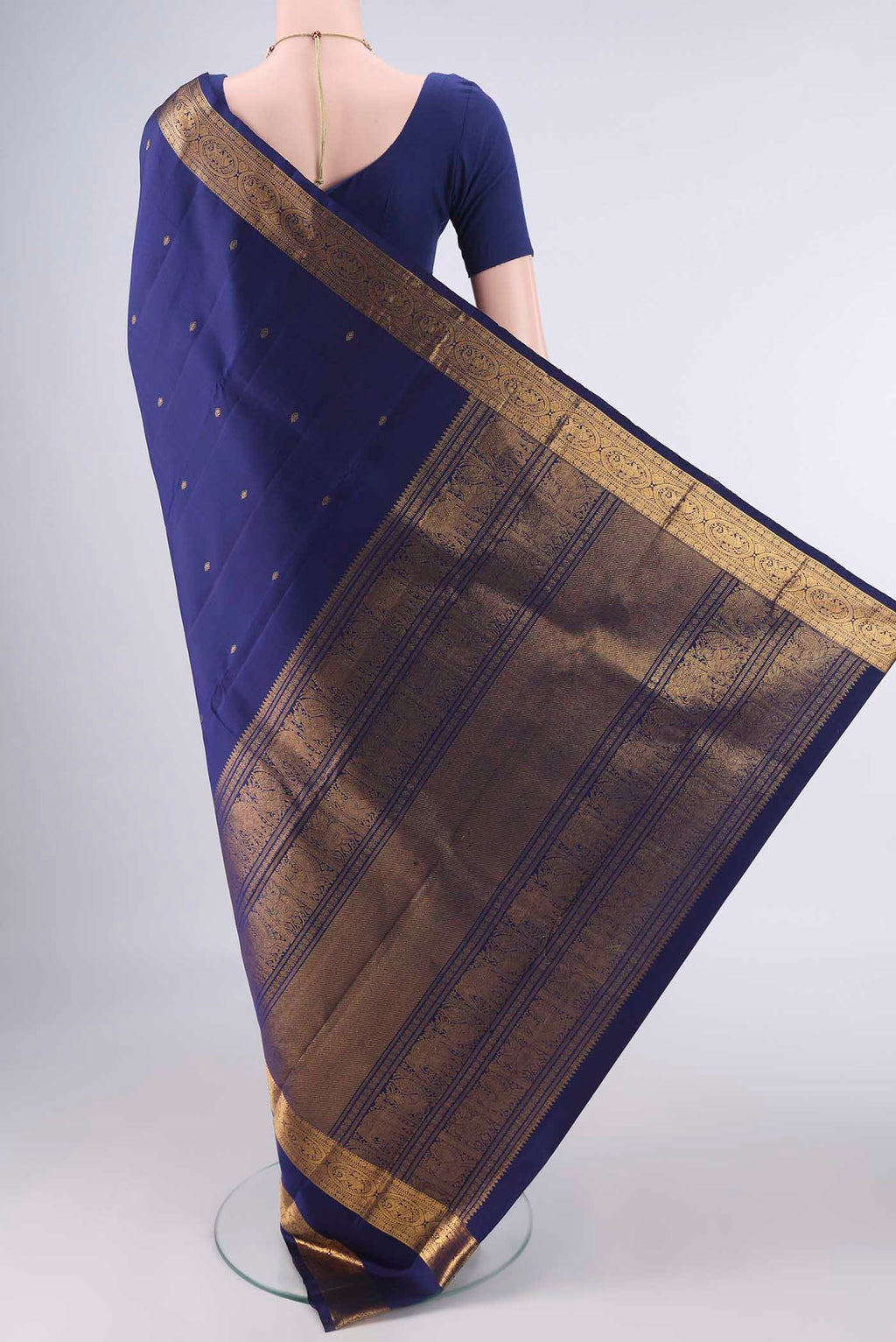 Flat view of Pure Silk Dark Blue Kanchipuram Saree with Zari Butta on the body and Zari Border. 