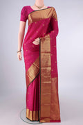 Pure Silk Rani Pink Kanchipuram Saree with Zari Butta on the body and Zari Border.  displayed on a mannequin