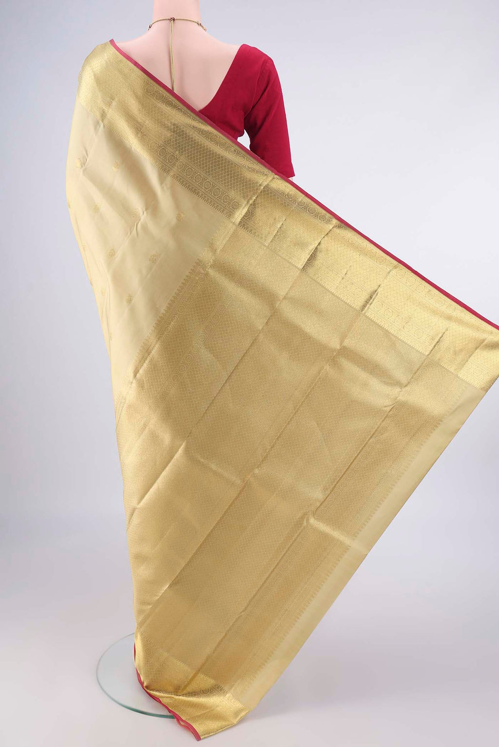 Flat view of Pure Silk Dark Beige Kanchipuram Saree with Zari Butta on the body and Zari Border. 