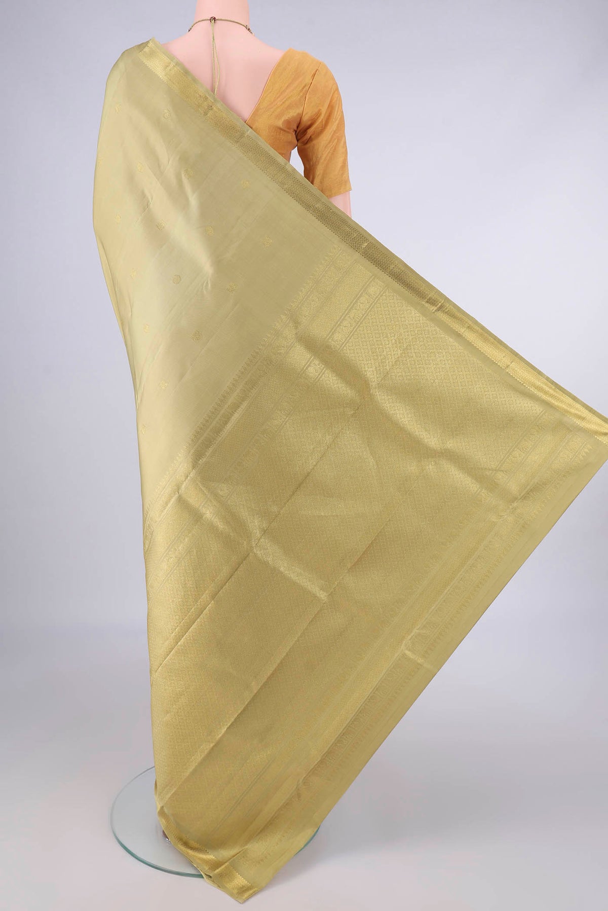Flat view of Pure Silk Beige Dual Tone Kanchipuram Saree with Zari Butta on the body and Zari Border. 