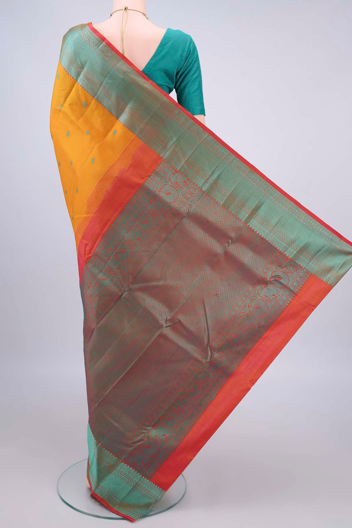 Flat view of Pure Silk Mustard Kanchipuram Saree with Thread Butta on the body and Thread Border. 