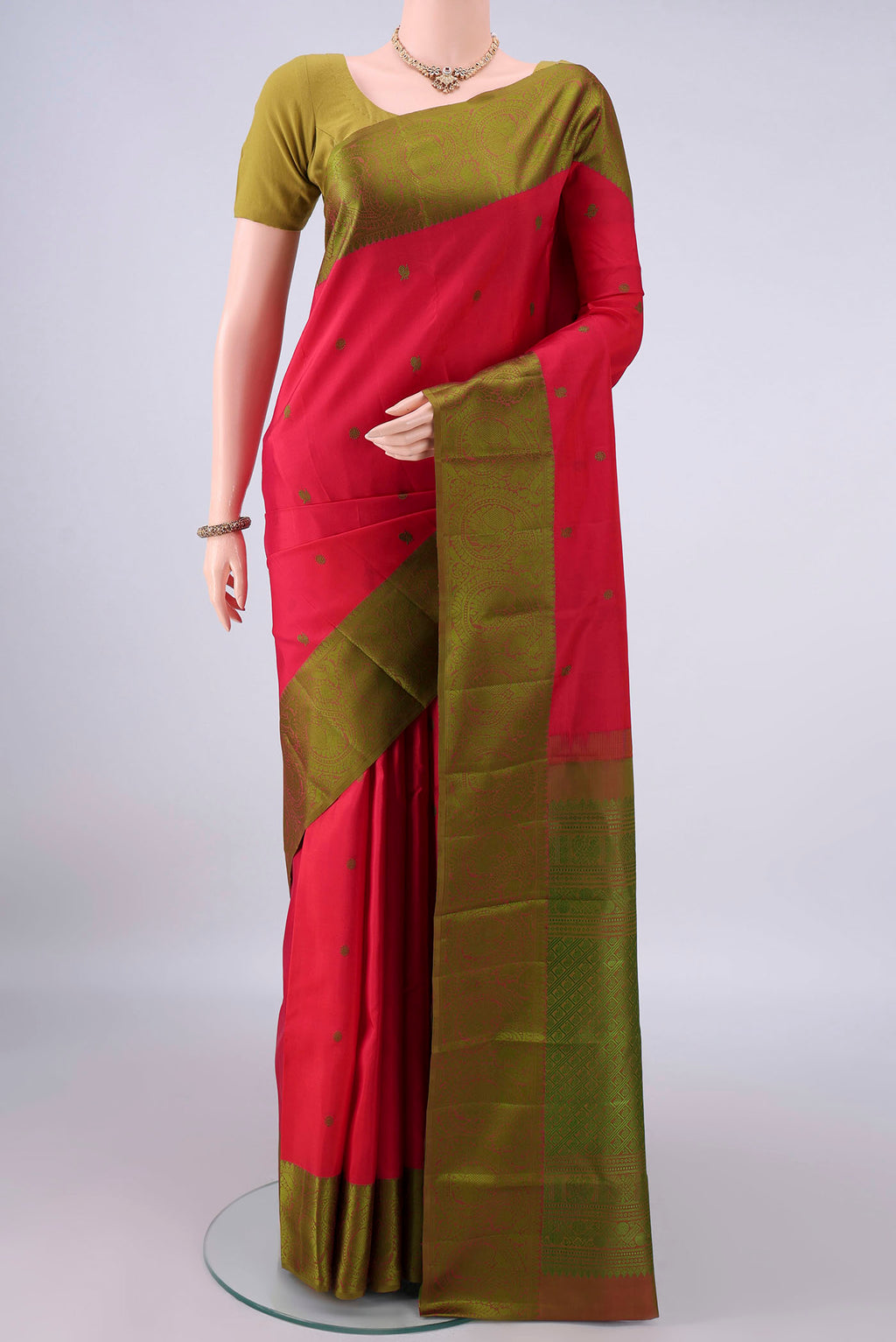Pure Silk Red Kanchipuram Saree with Thread Butta on the body and Thread Border.  displayed on a mannequin