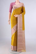 Pure Silk Mustard Kanchipuram Saree with Thread Butta on the body and Thread Border.  displayed on a mannequin