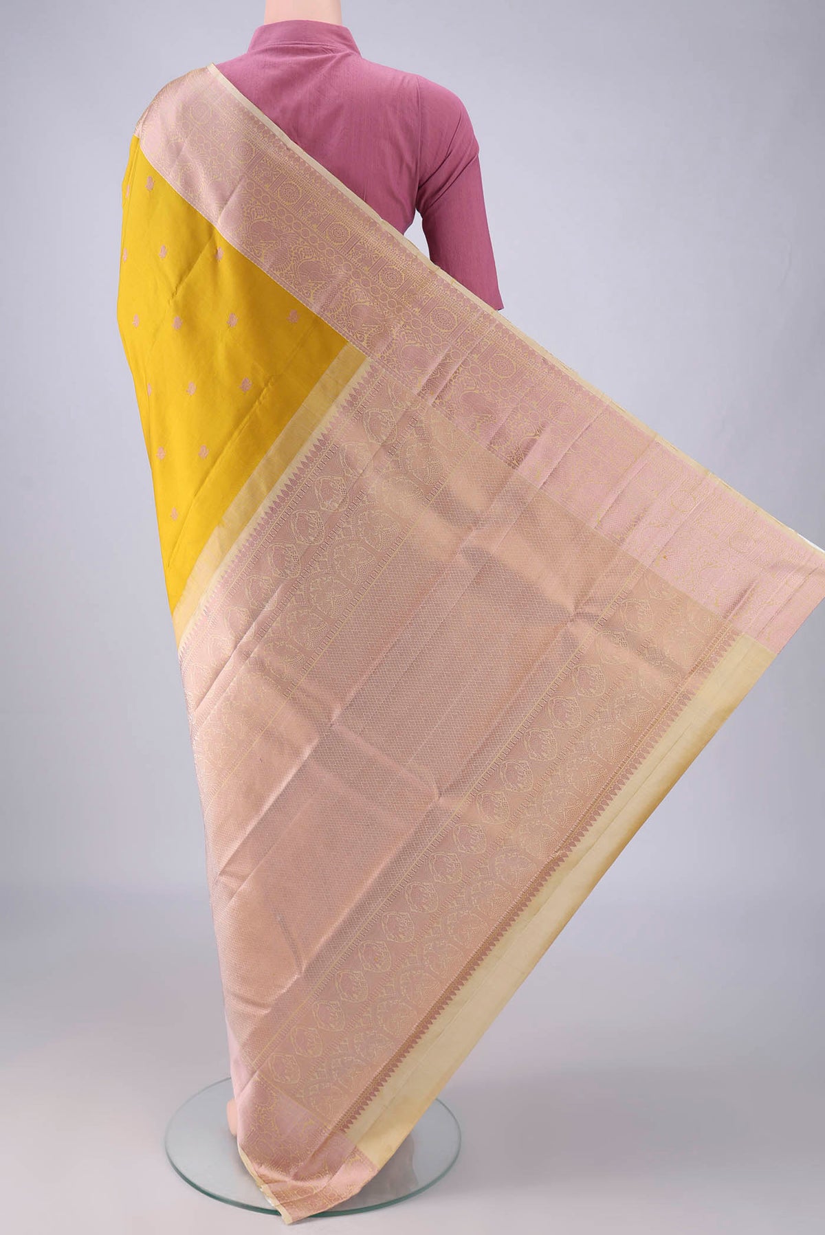 Flat view of Pure Silk Mustard Kanchipuram Saree with Thread Butta on the body and Thread Border. 