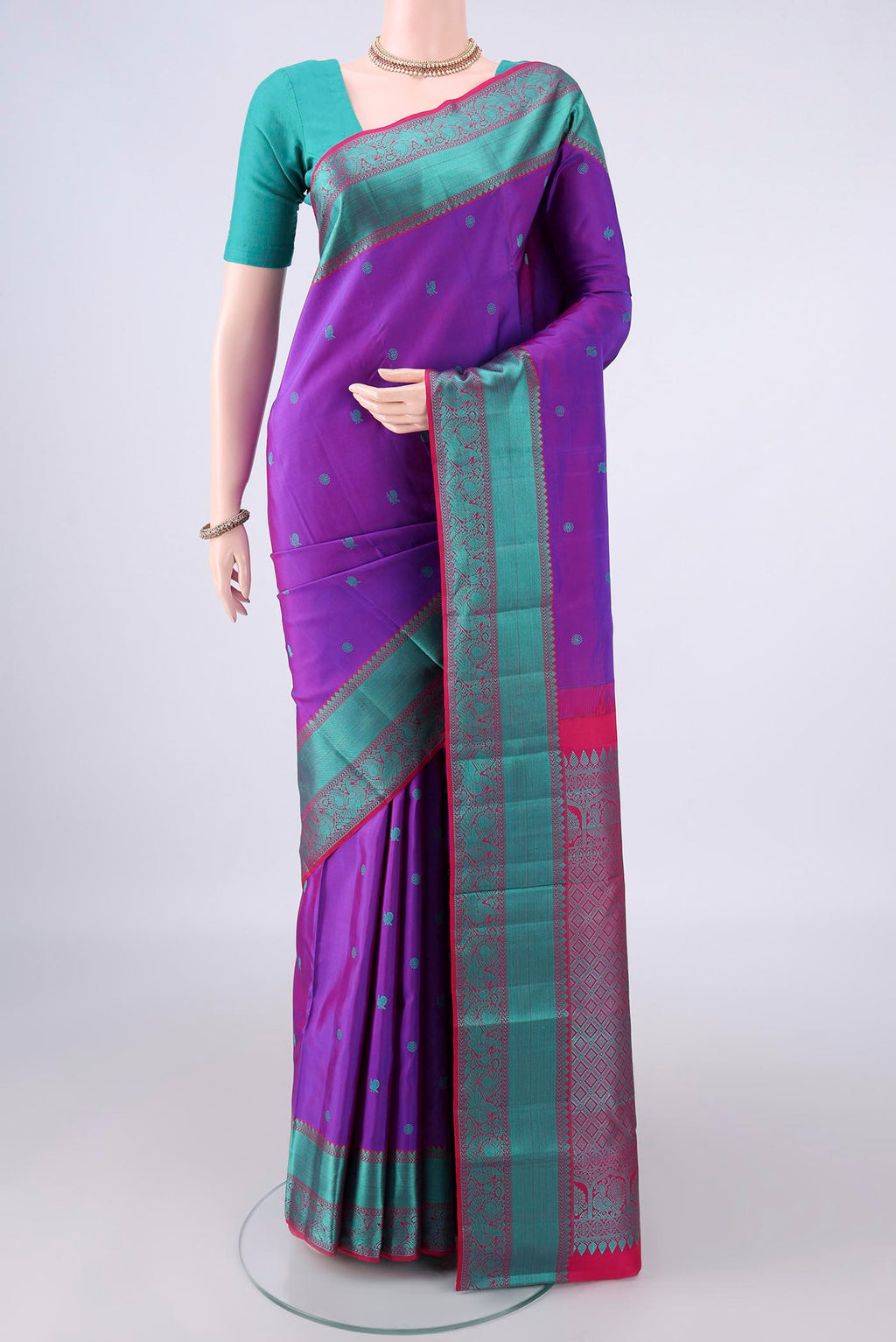 Pure Silk Purple Kanchipuram Saree with Thread Butta on the body and Thread Border.  displayed on a mannequin