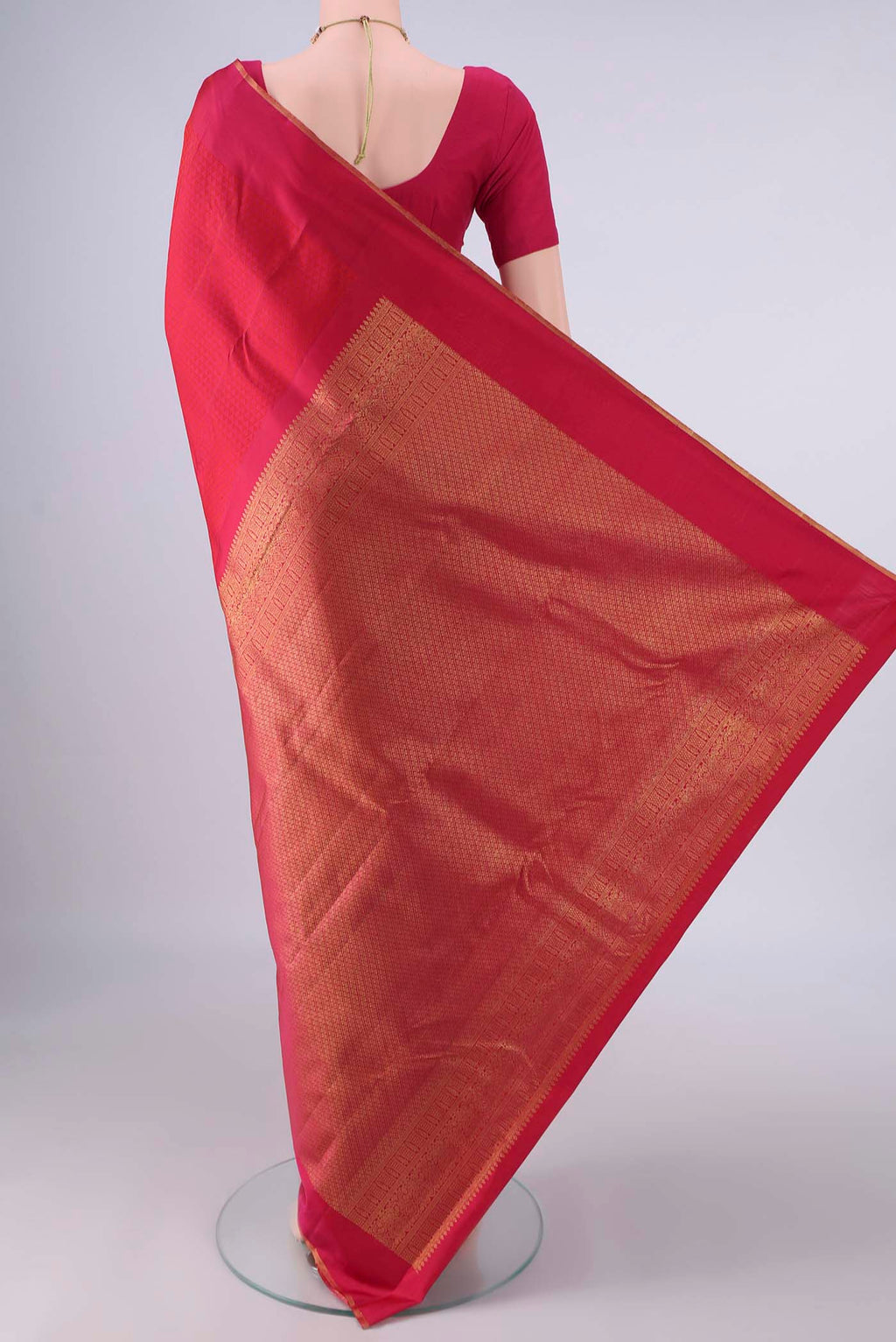 Flat view of Pure Silk Dark Pink Kanjivaram Saree with Jacquard design on the body and Zari Border. 