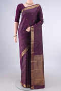 Pure Silk Purple Kanchipuram Saree with Zari Butta on the body and Zari Border.  displayed on a mannequin