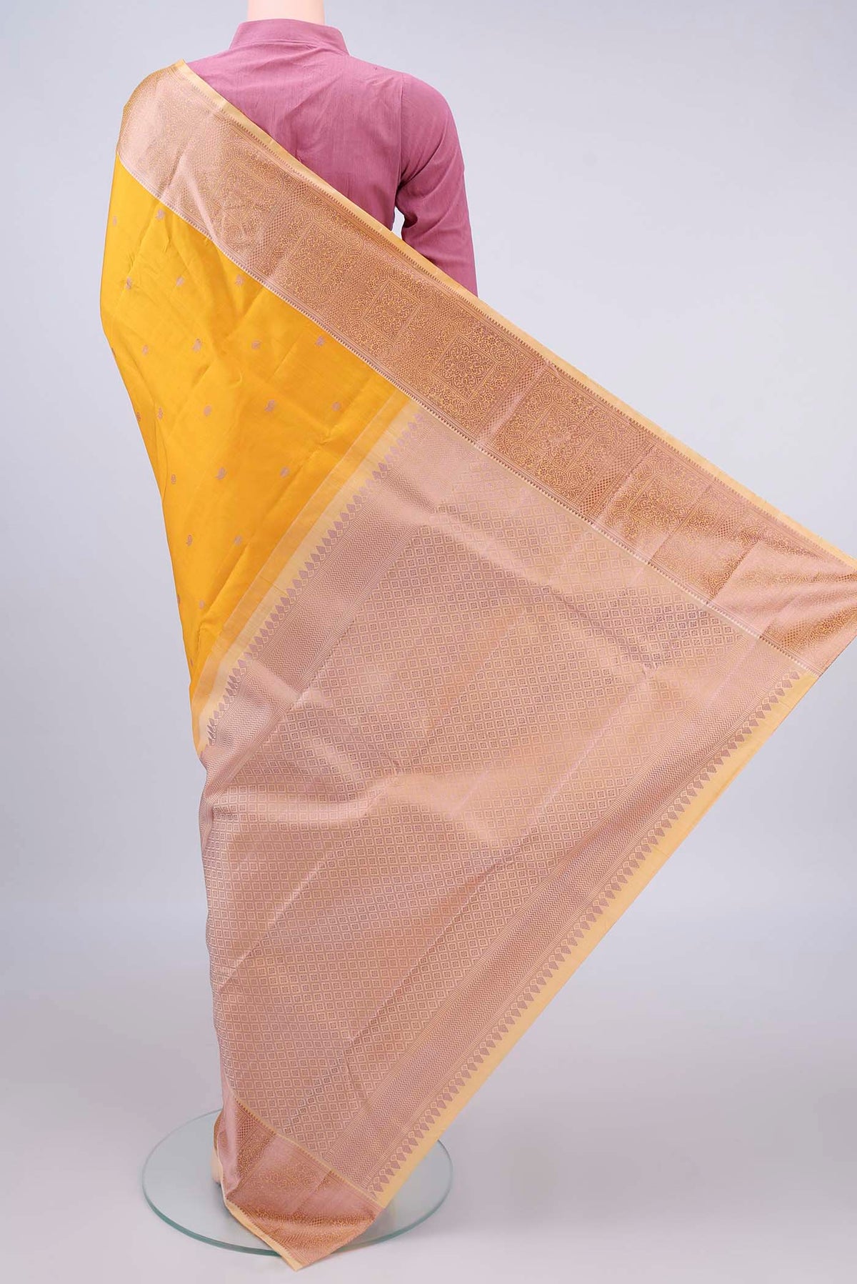 Flat view of Pure Silk Mustard Kanchipuram Saree with Thread Butta on the body and Thread Border. 